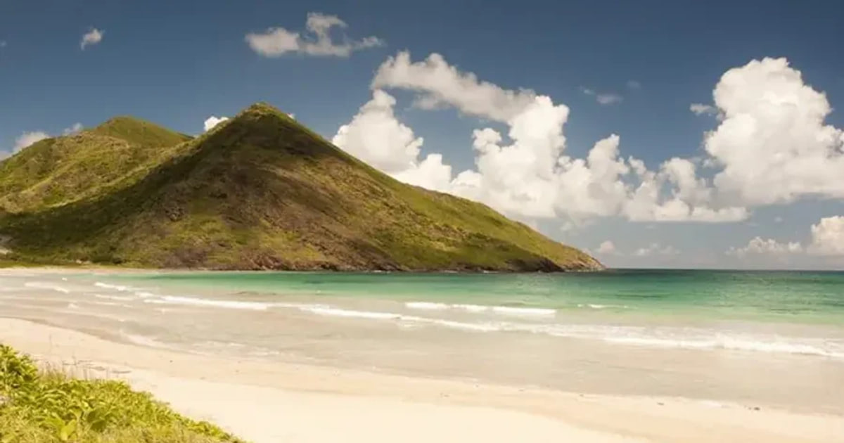 Green hills meeting the sea in St. Kitts