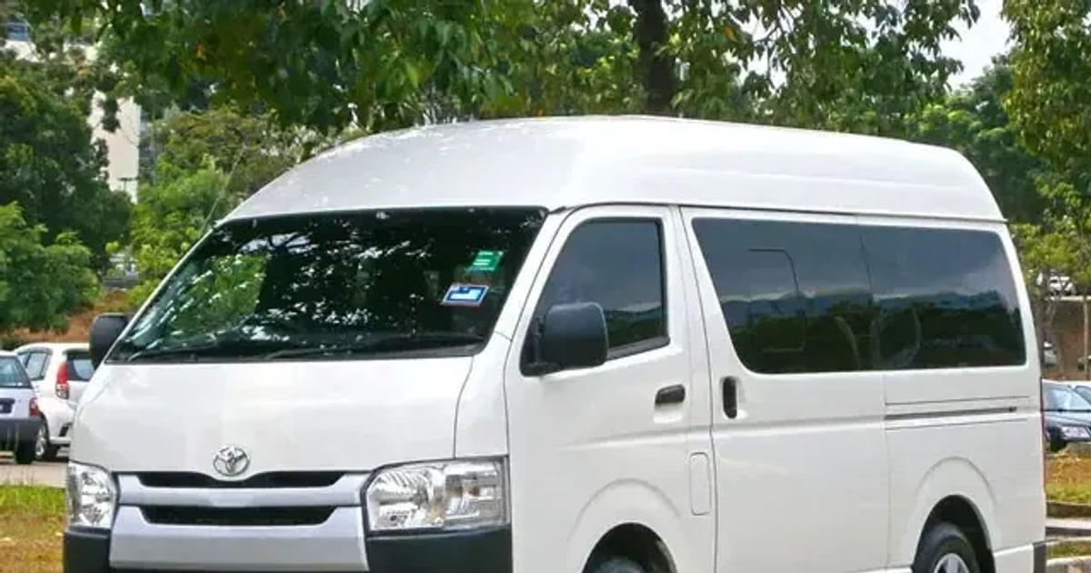 Open-sided taxi on a coastal road in St. Kitts